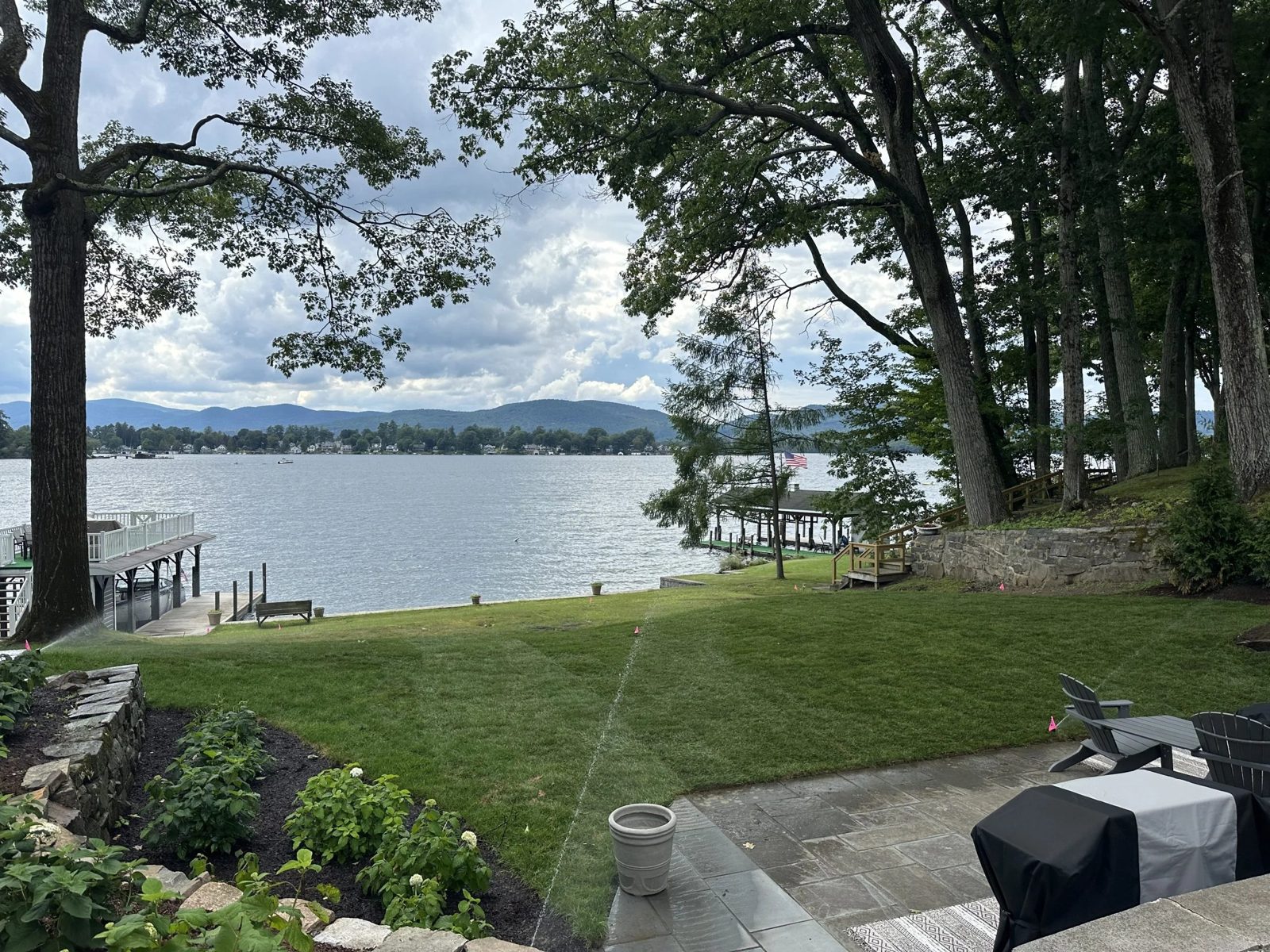 Lakefront lawn and bluestone patio overlooking Lake George